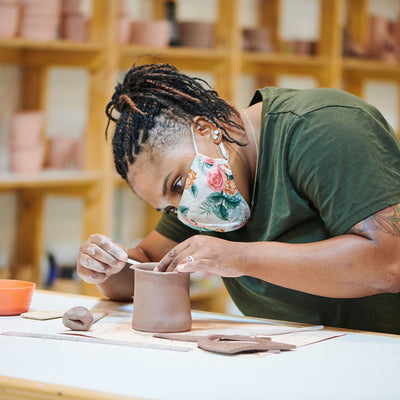 Student taking a mug handbuilding workshop at pot gardens studio in mid-city los angeles